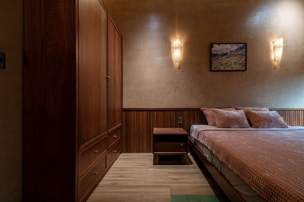 Bedroom with timber wall panels
