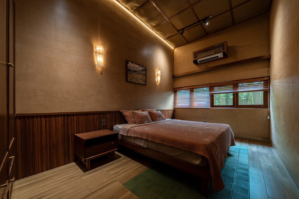Bedroom with timber furniture and tiled floor