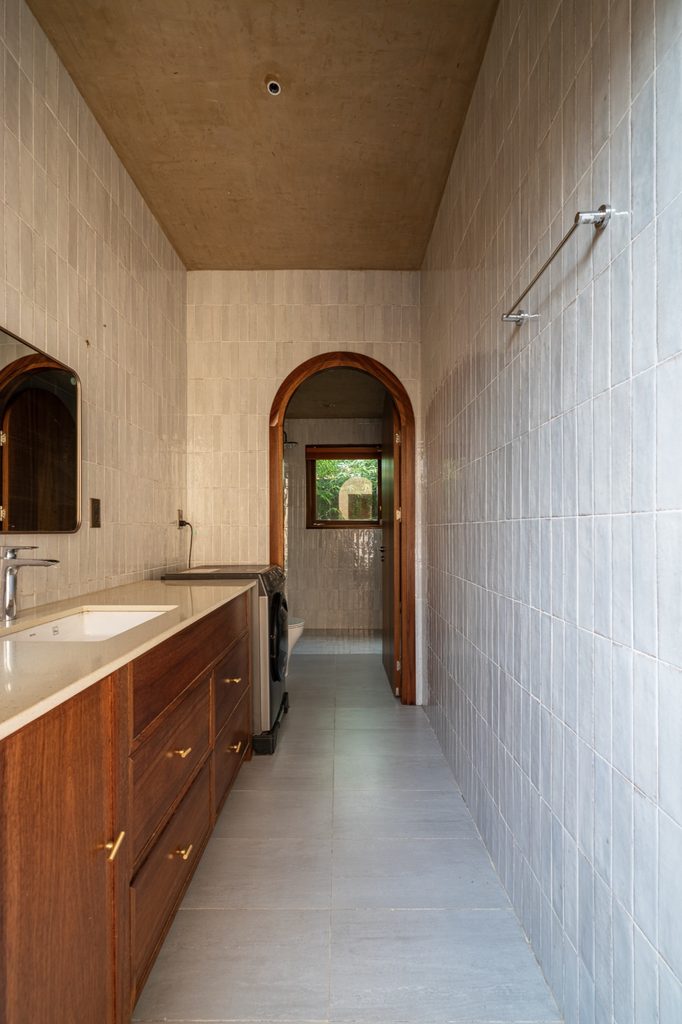 Narrow bathroom with a timber vanity