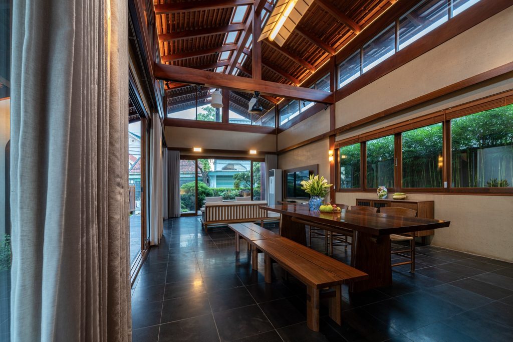 Dining table beside the glazed veranda