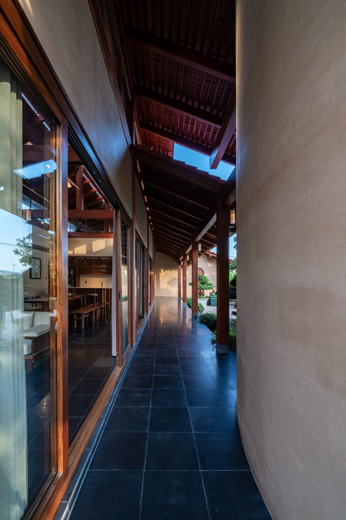 Narrow covered passage along the house