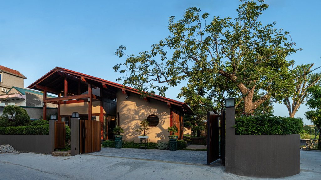 Exterior of U House framed by mature trees