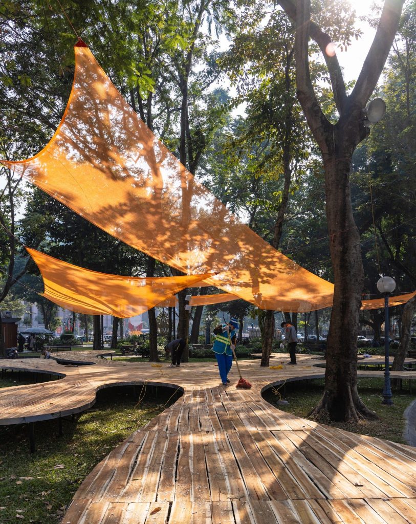 Light through orange fabric over the slatted deck