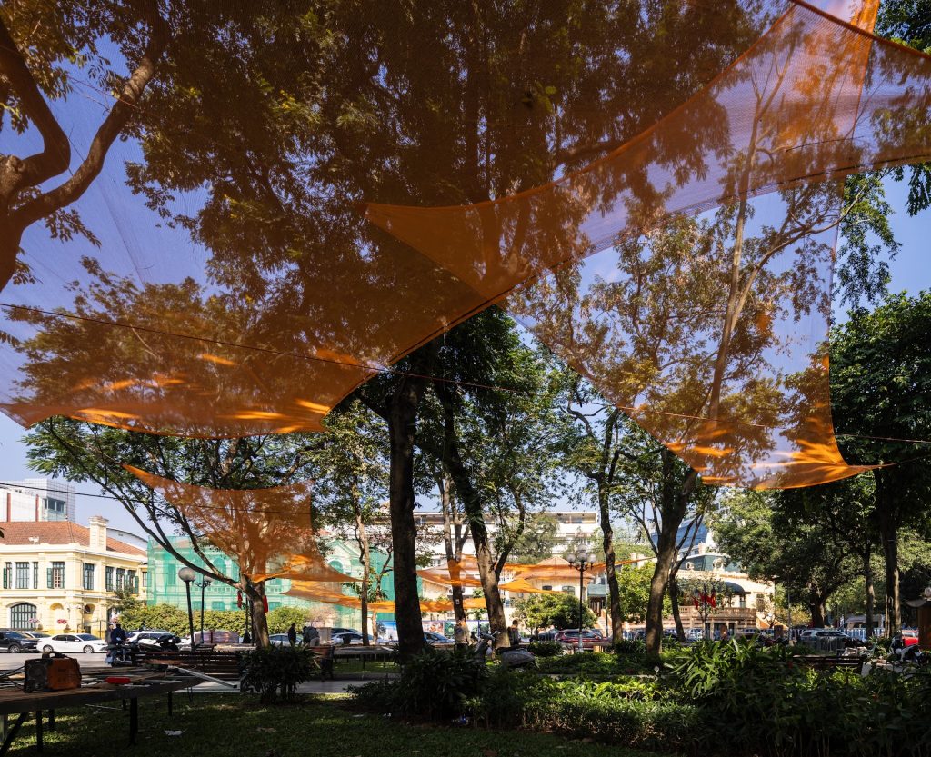 Looking up through orange cloth to the sky