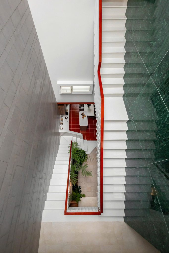 Overhead view of the staircase and green tiled wall