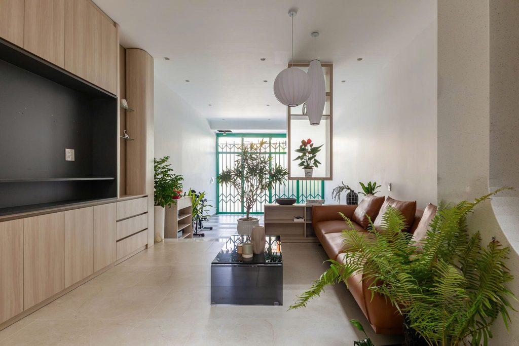 Living room with timber cabinetry and a brown sofa