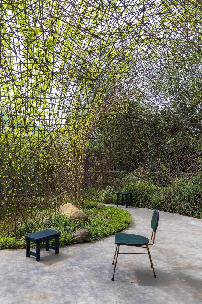 Chairs beneath the woven shell