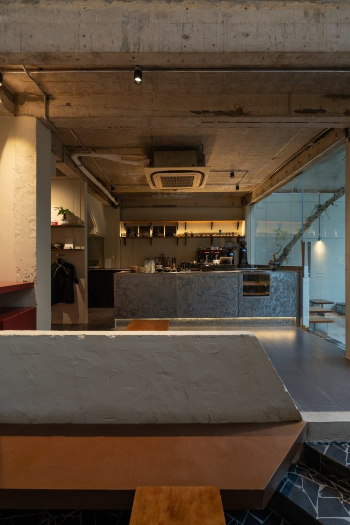Day1 Cafe by oh.hi studio, bar counter and seating around the central void
