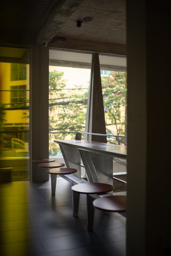 Day1 Cafe by oh.hi studio, counter seating facing the street glazing
