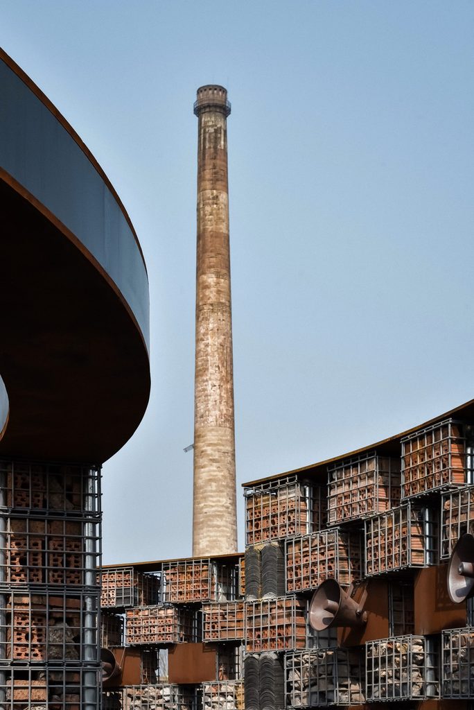 Former factory chimney beside the circular museum