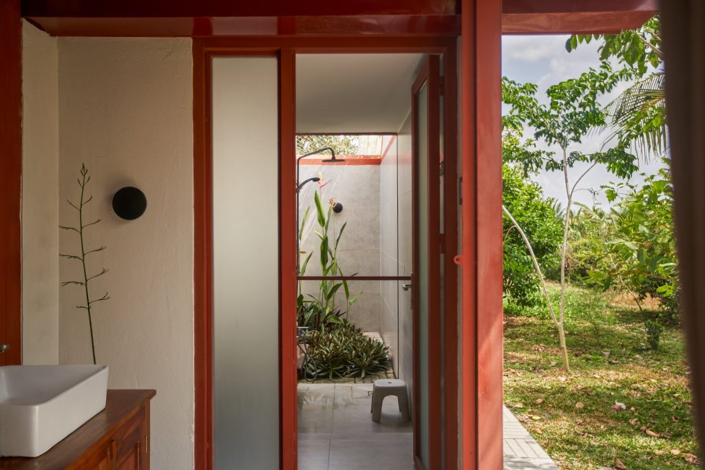 Garden House by aha.studio.arc, Go Quao, An Giang, bathroom block opening to the garden