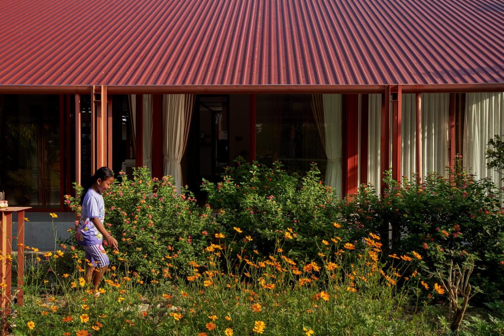 Garden House by aha.studio.arc, Go Quao, An Giang, front flower garden and veranda