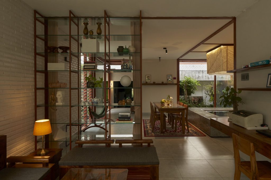 Garden House by aha.studio.arc, Go Quao, An Giang, living room with steel shelving