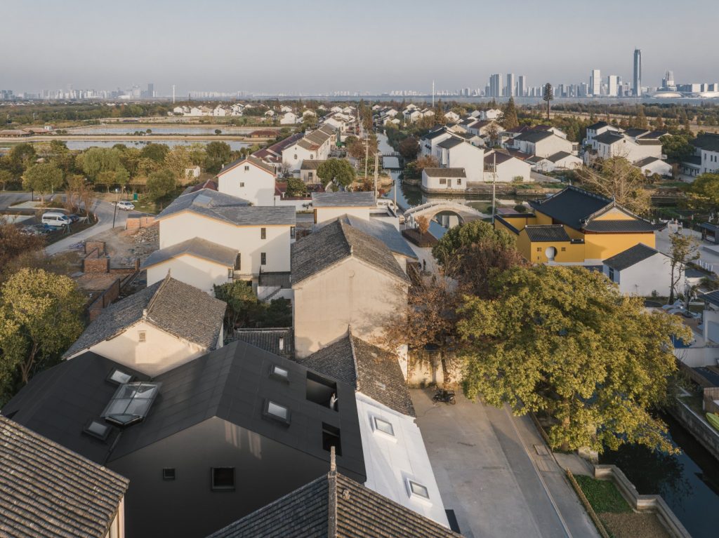 The building in the village with a city skyline beyond
