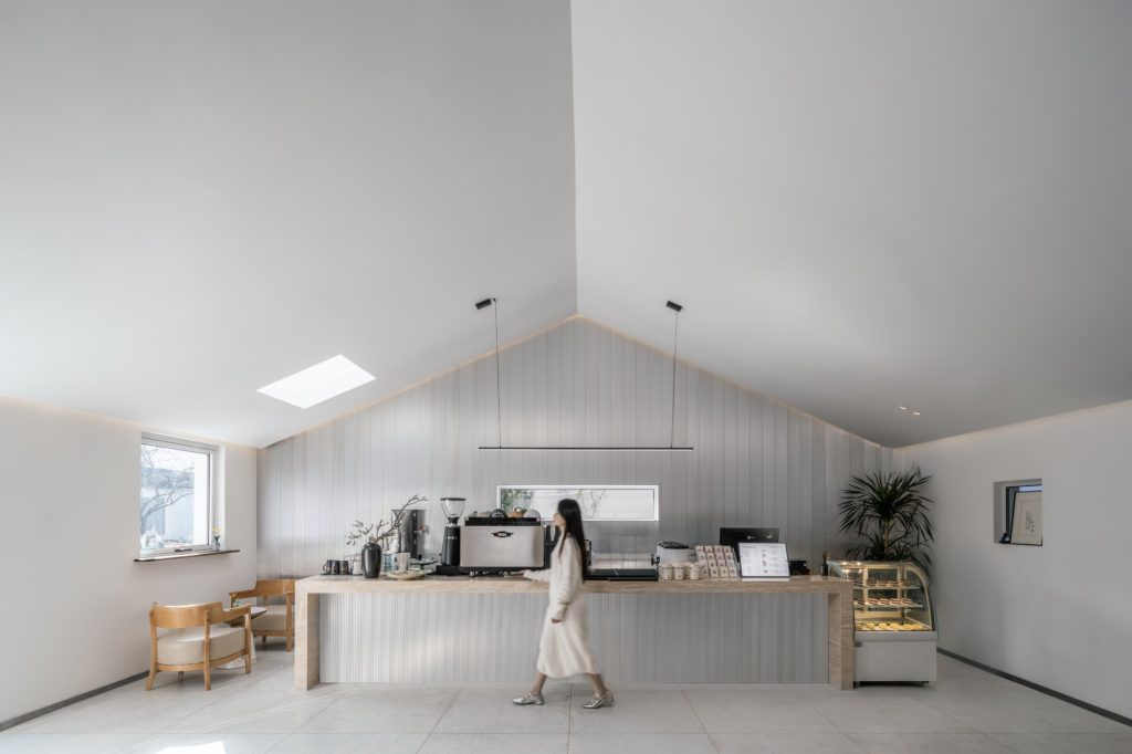Café in the white pitched-roof house