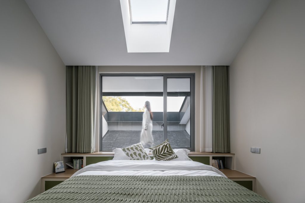 Guest room with a skylight above the bed