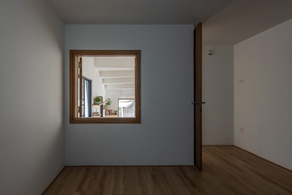 Timber-floored room with an internal window