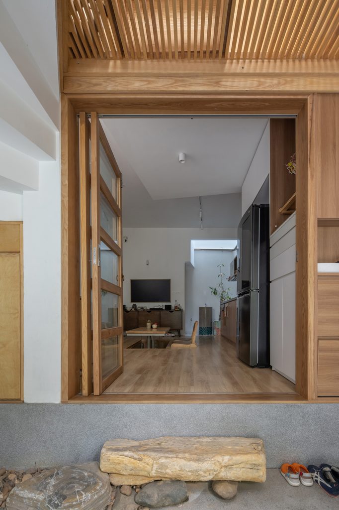 Living space beneath an open slatted timber floor