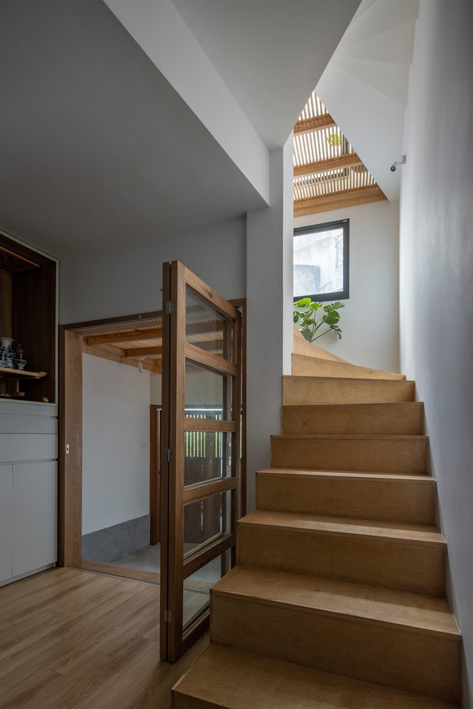 Timber stairs beside a glazed door
