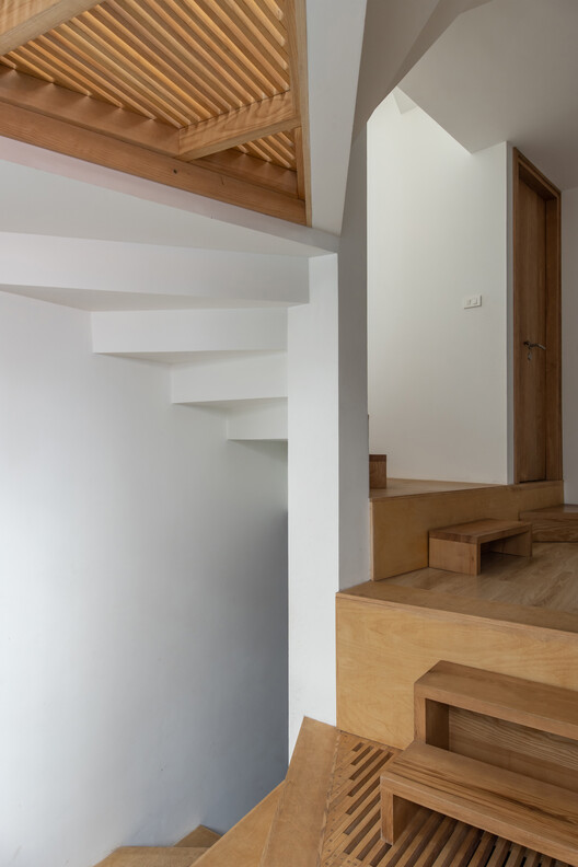 Timber landing beneath slatted flooring