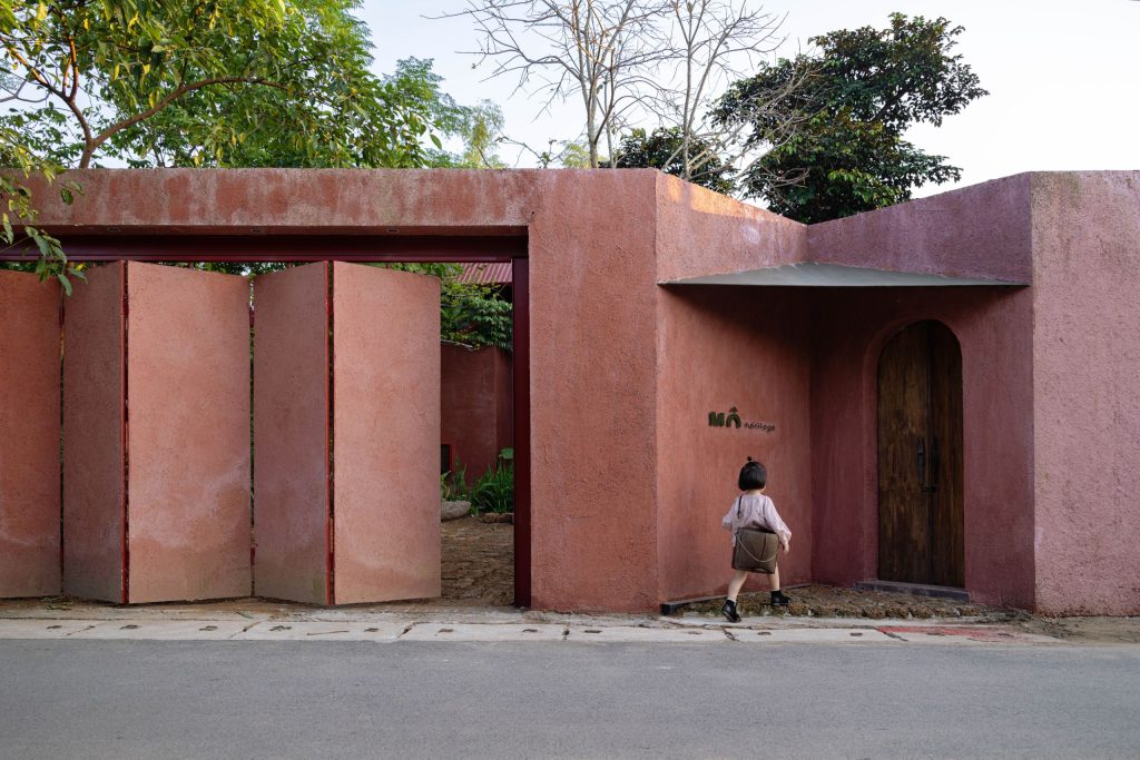 Entrance between earthen wall panels