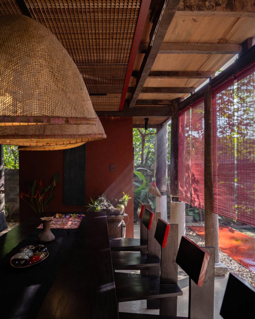 Dining area under woven pendant lights