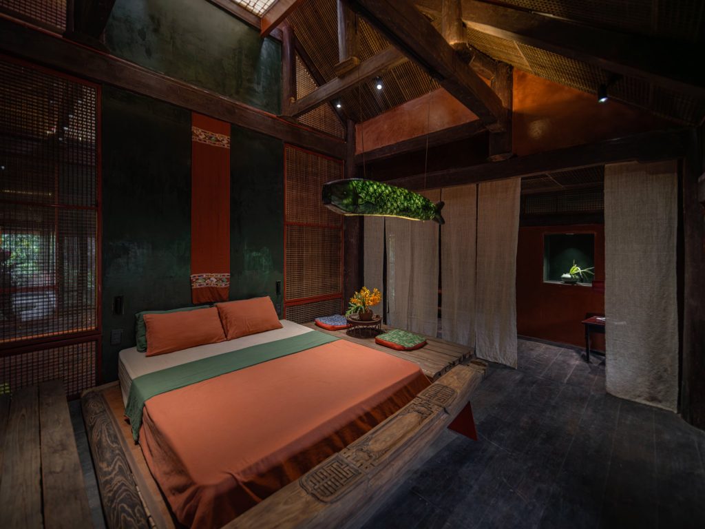 Bedroom under the timber roof structure