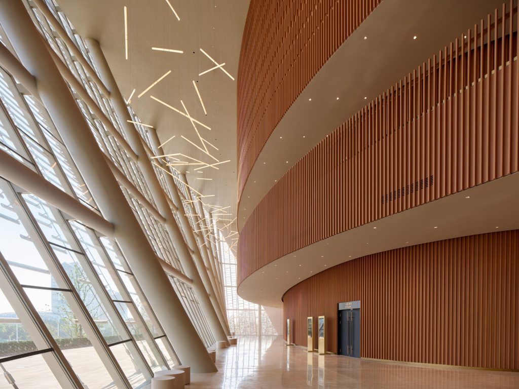 Foyer with bamboo-clad walls and glazed facade