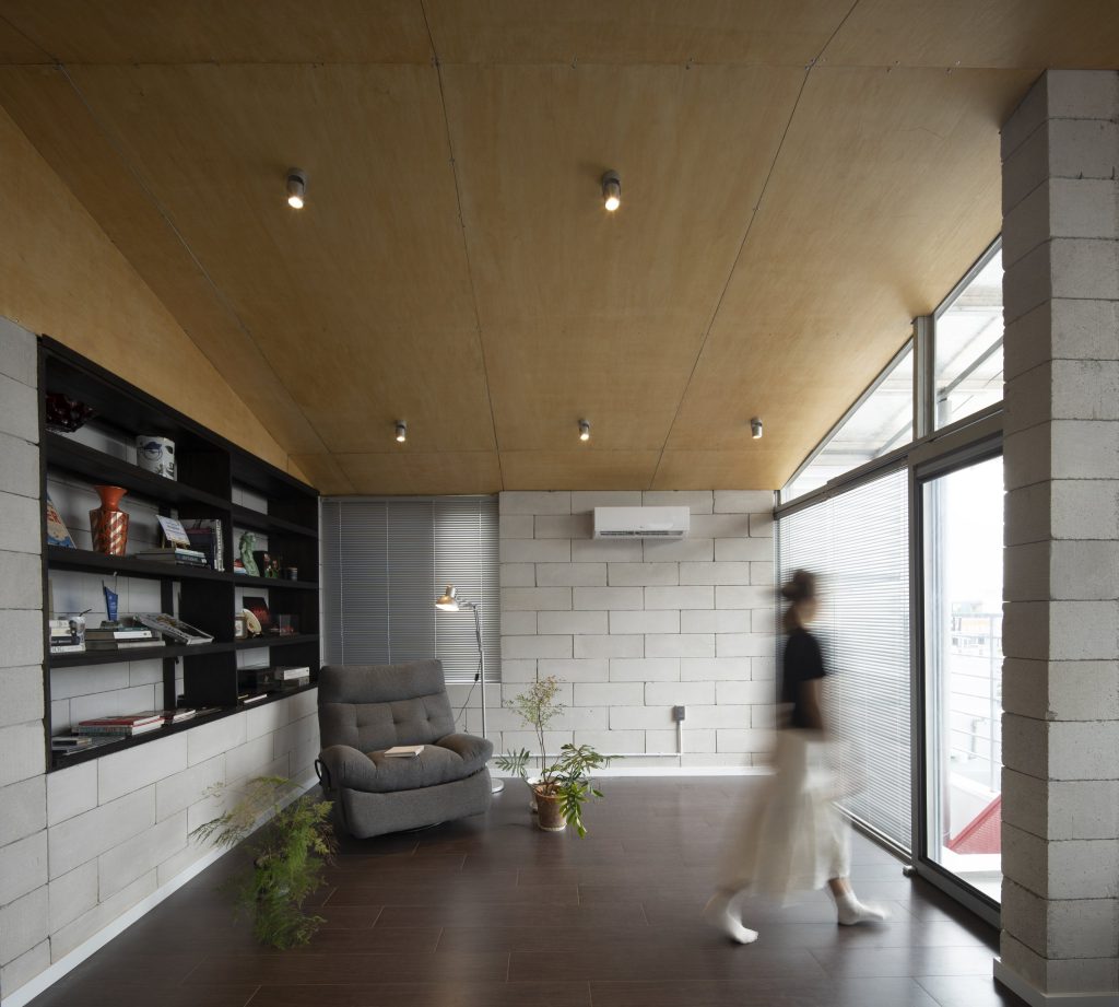 Room Above by scale50, Ho Chi Minh City, workspace with shelving and block walls