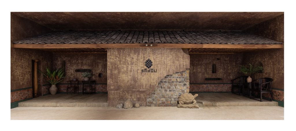 The shopfront under a canopy of curved roof tiles