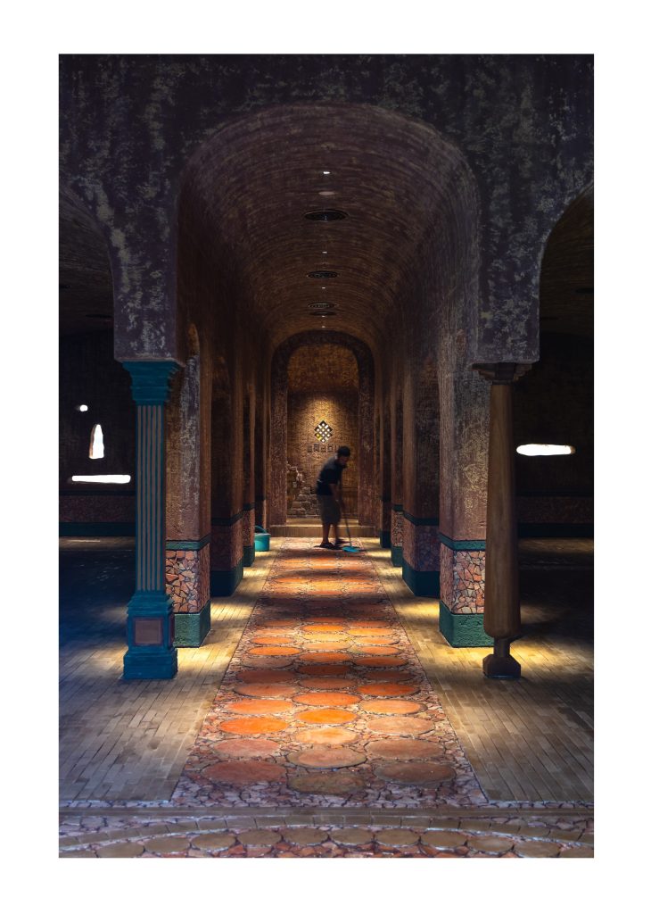 A diner walking down the arcade