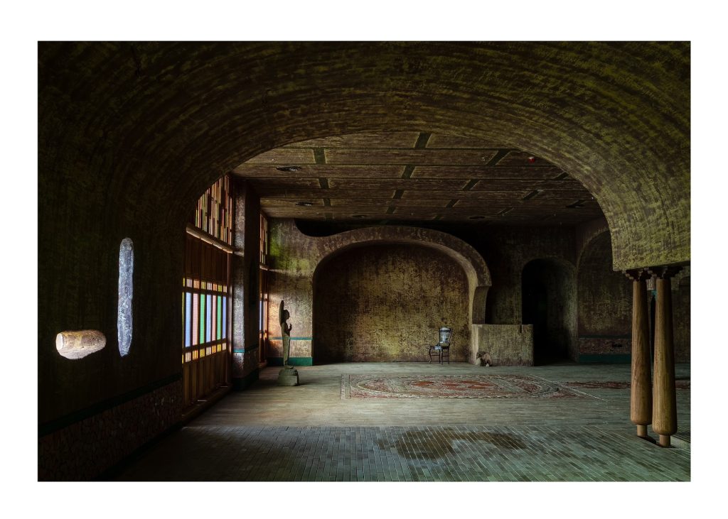 Vaulted room with a stained glass window