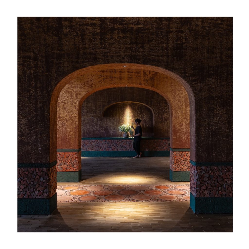 Wide arch over a warm lit floor