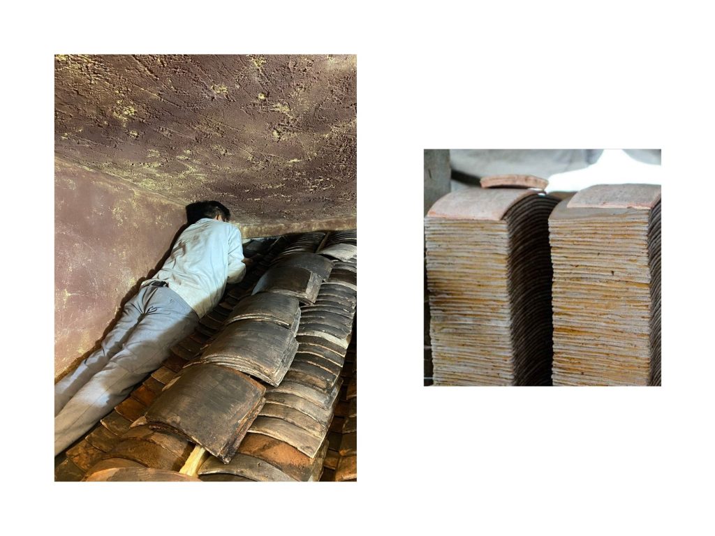 A craftsman setting old roof tiles into the vault