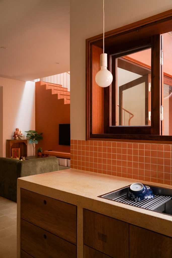 Kitchen counter and timber window overlooking the living room