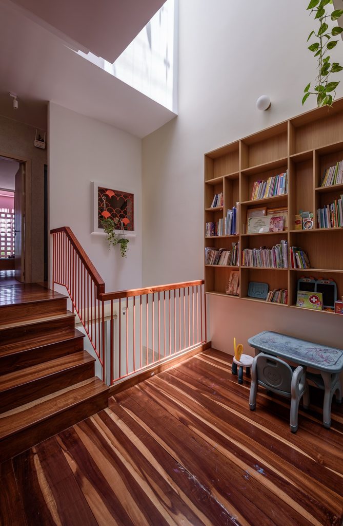 Timber stair and reading area arranged around the central void