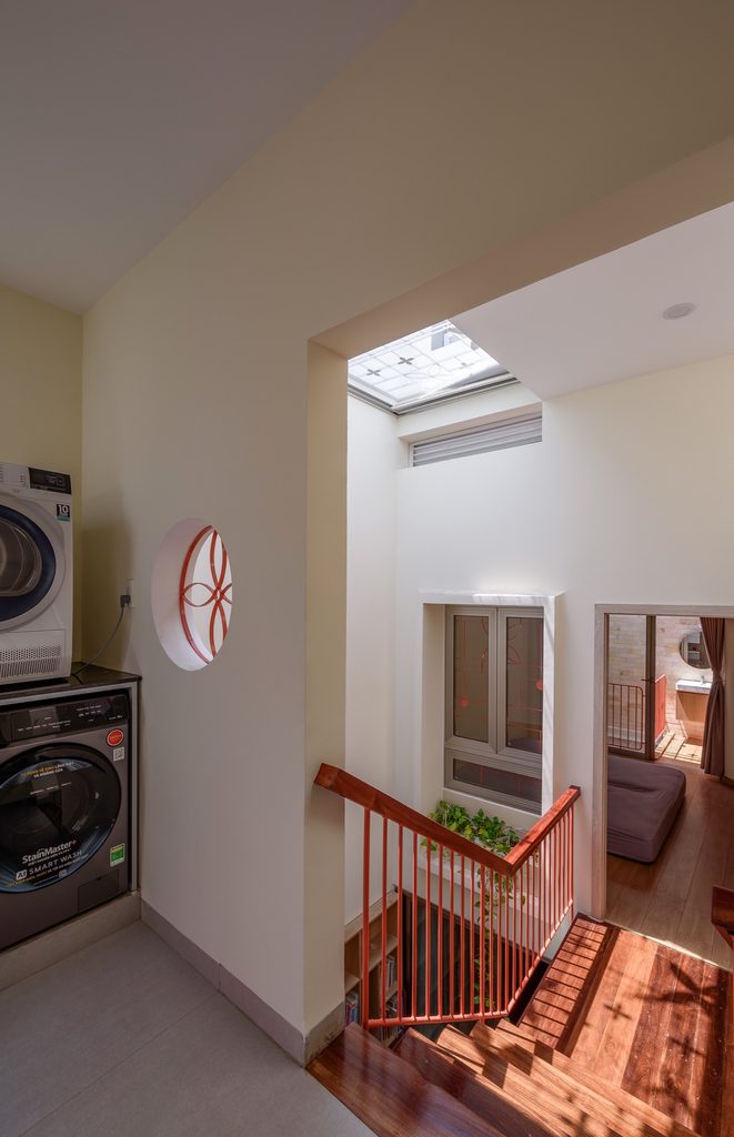 Laundry area beside the stair void and timber floor