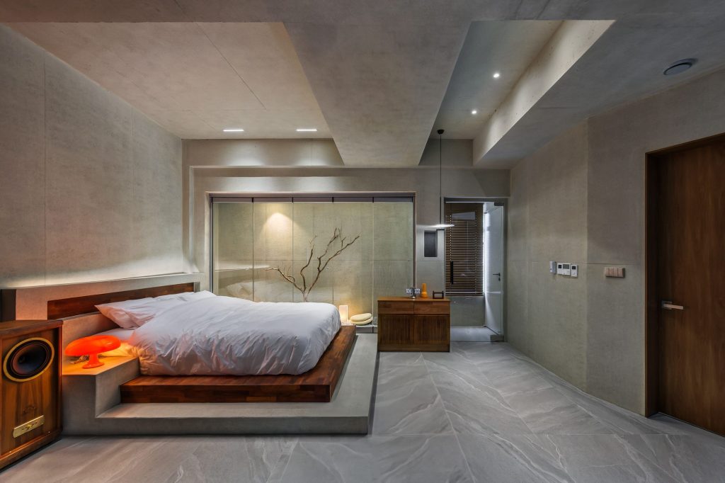 Guest bedroom with timber furniture and gray finishes