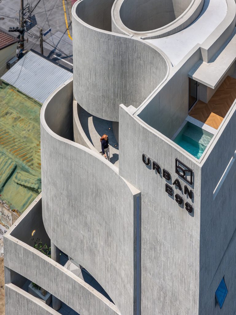 Upper terraces wrapped in curved concrete walls