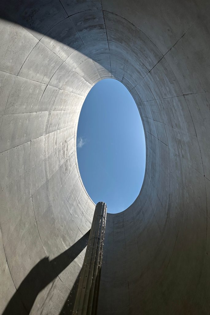 Oval opening to the sky above the pool