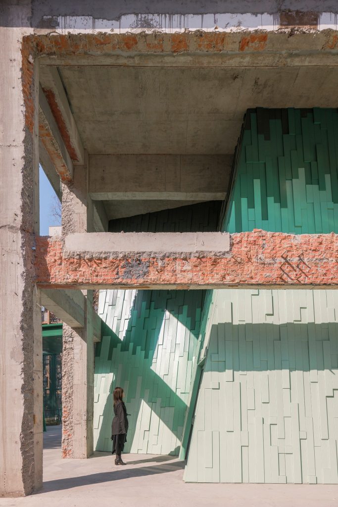 Inclined green panels under the old frame