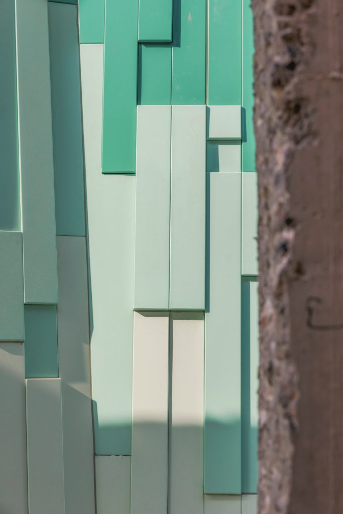 Pale and dark green panels in vertical strips