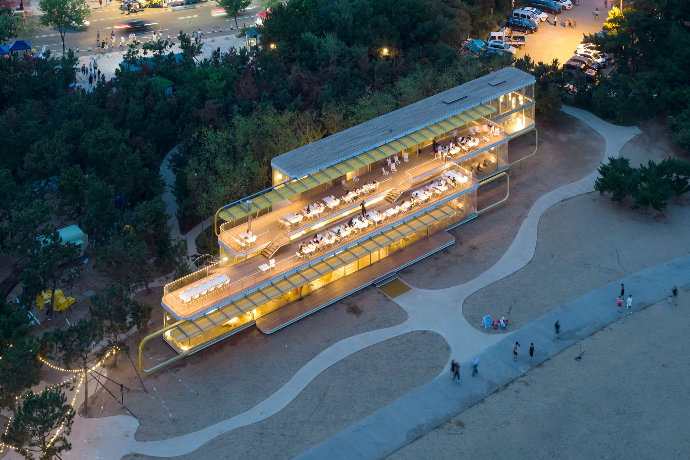 A transparent pavilion between pine forest and sea in rizhao