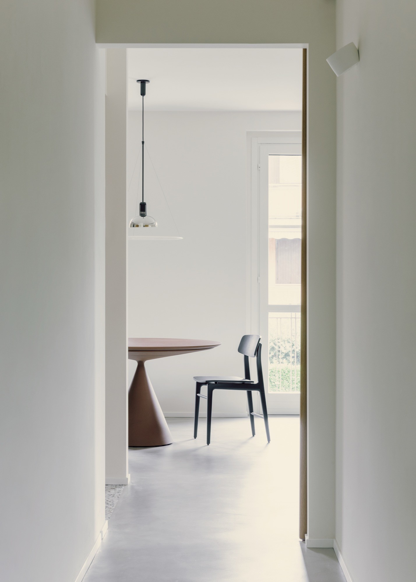 A home renovation defined by sliding thresholds and studio life