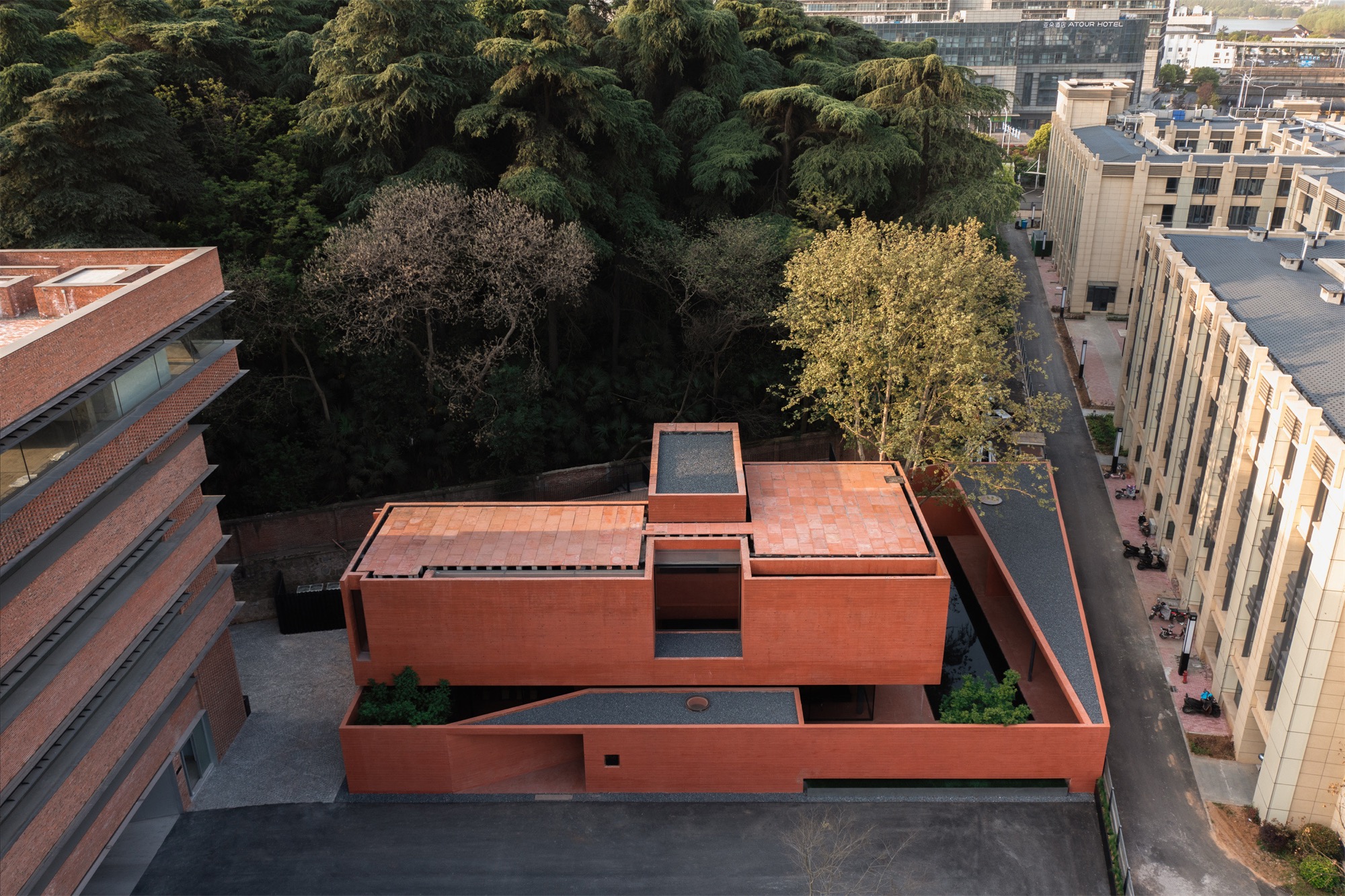 Mix Architecture wraps Nanjing’s Red Mountain in iron-oxide concrete with Red Box