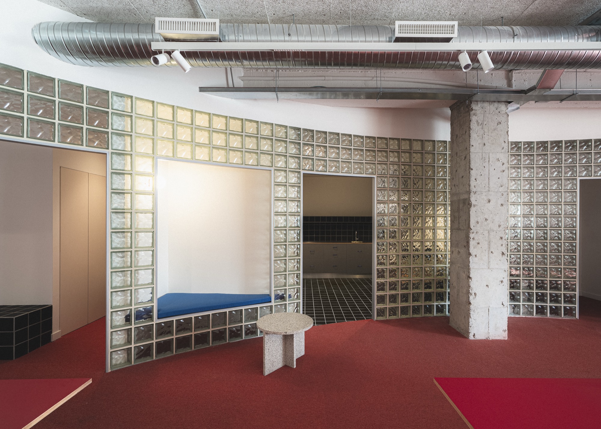 Diagonal cut and curved wall define Museo del Jamón headquarters