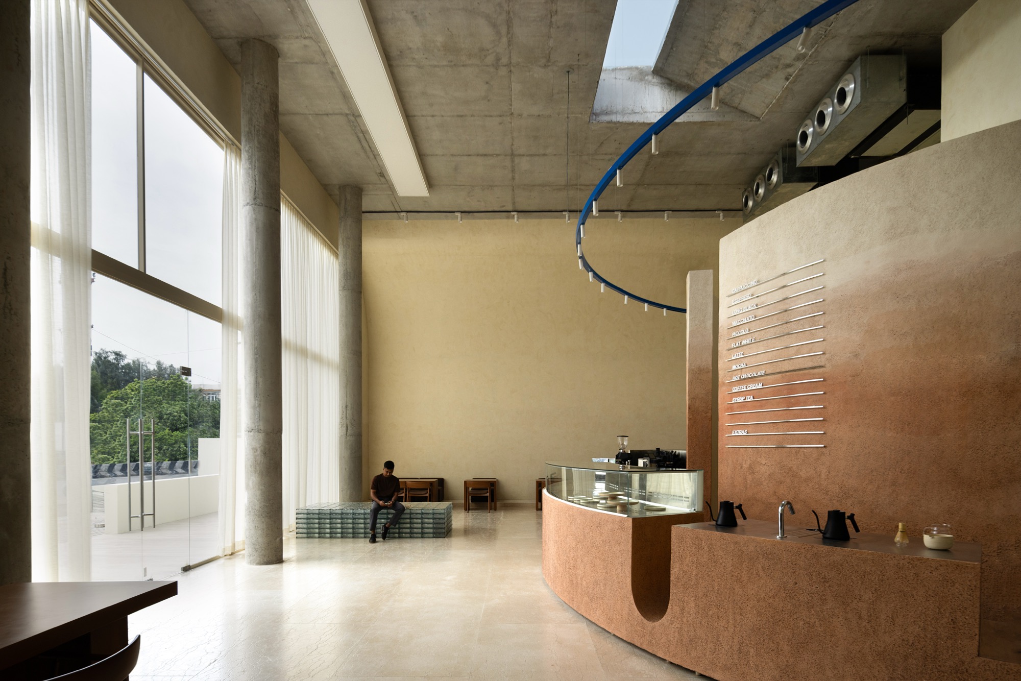 Eventide Coffee in Chennai shaped around elliptical counter and skylight