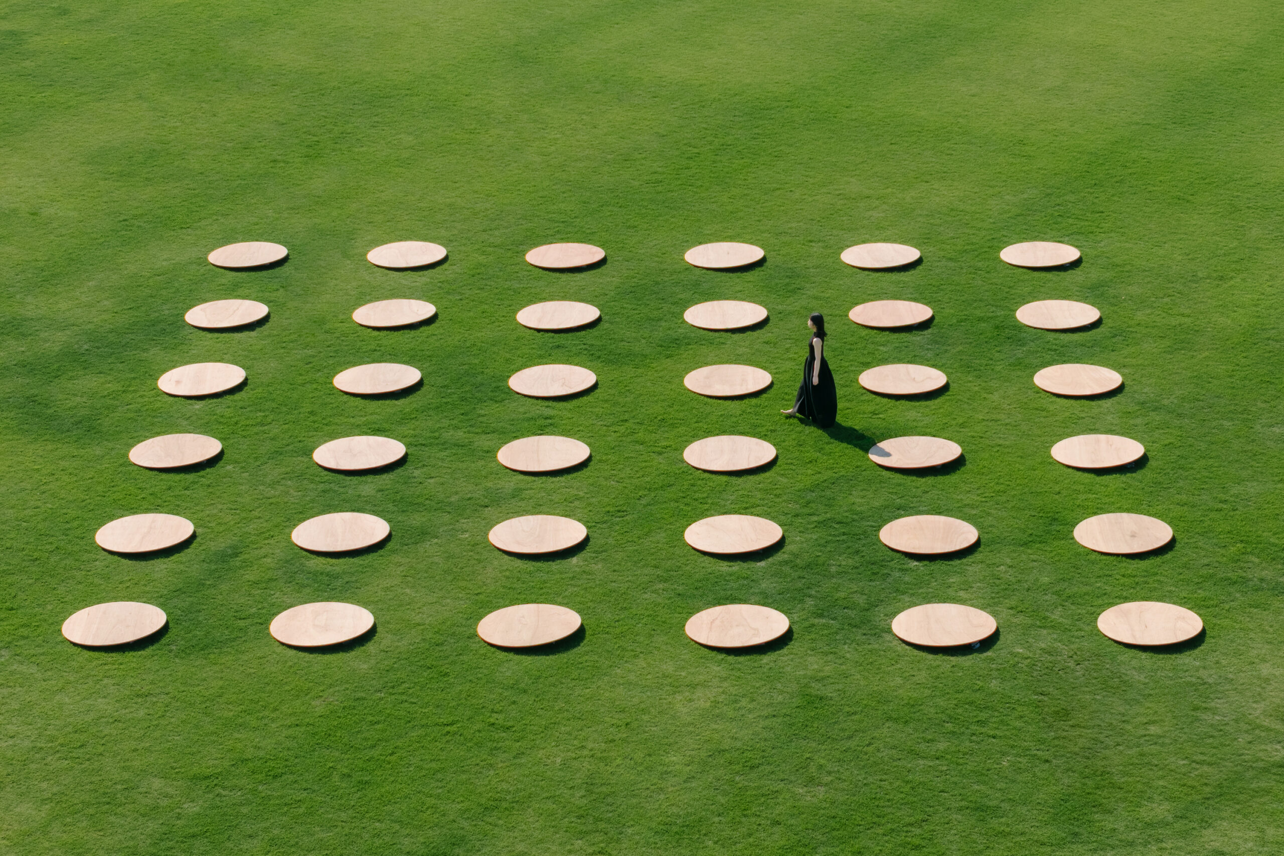 Moulding the Arc installation uses circular plywood discs to map early human settlements