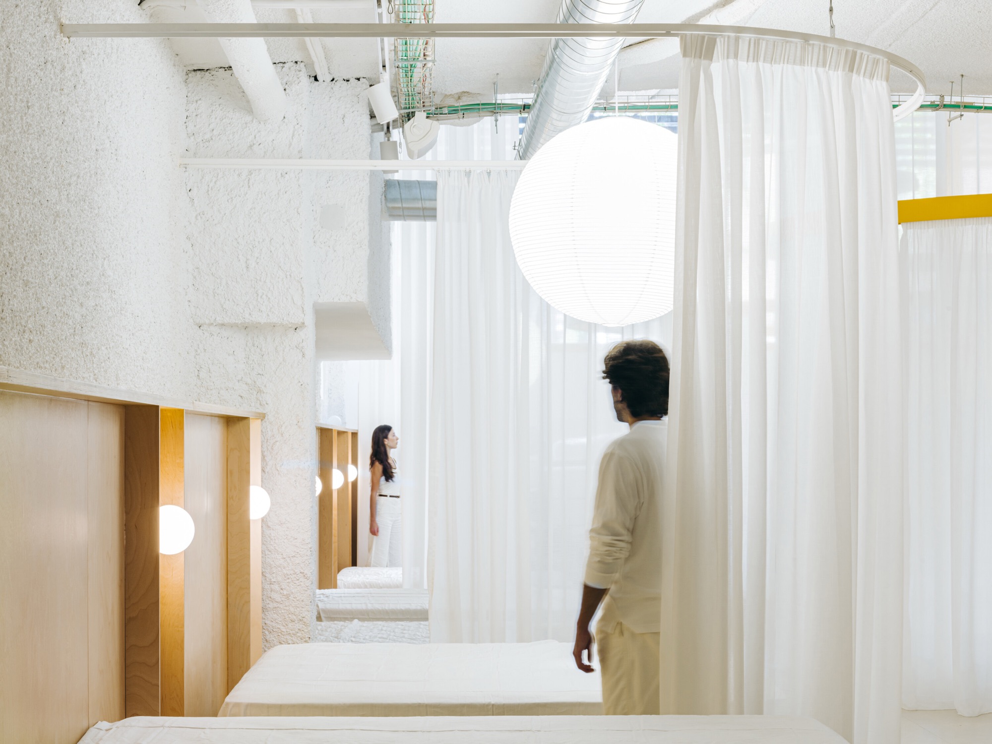 JOTAJOTA+ turns a mattress store into a sequence of domestic interiors