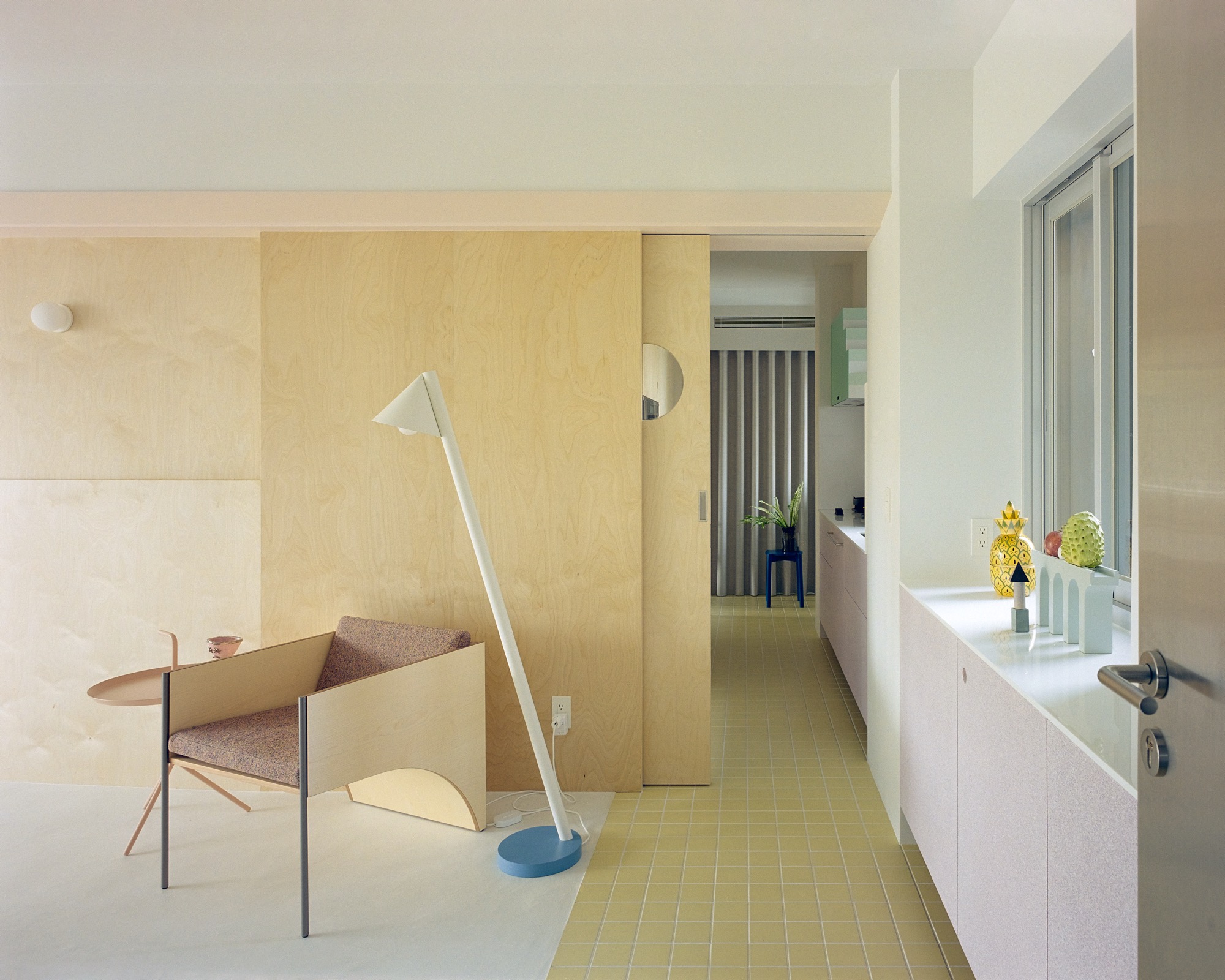 Taipei apartment for three generations revolves around birch plywood core